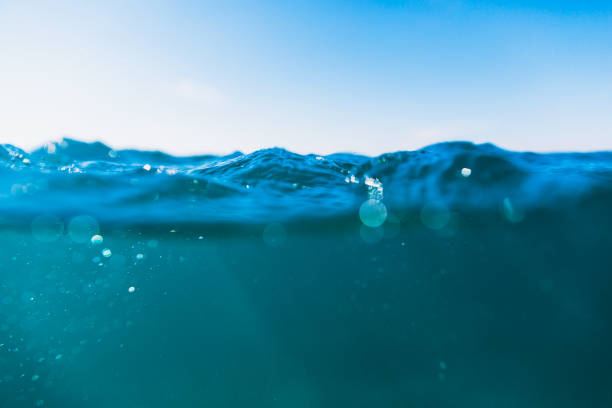 Underwater air bubbles in ocean. Water texture with bokeh.