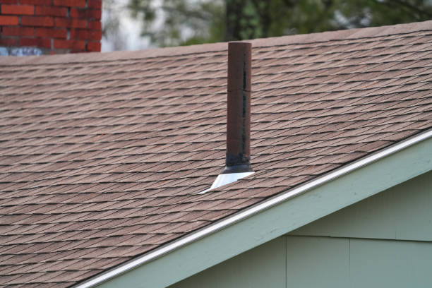 house rooftop with shingle and old rustic metal exhaust